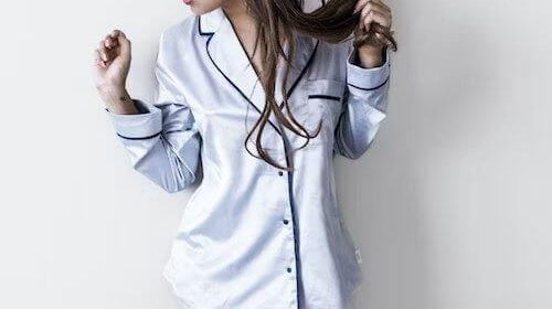 person wearing light colored satin pajama top