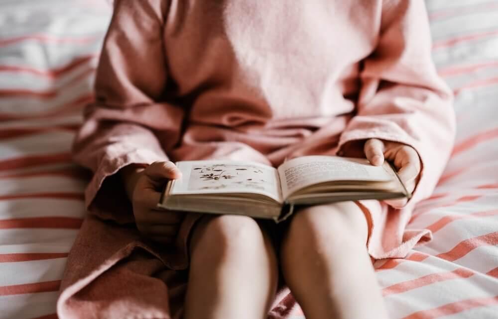 Woman reading in bed