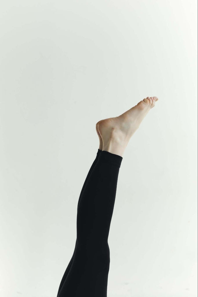 Alt-text: an image of a woman’s legs wearing leggins